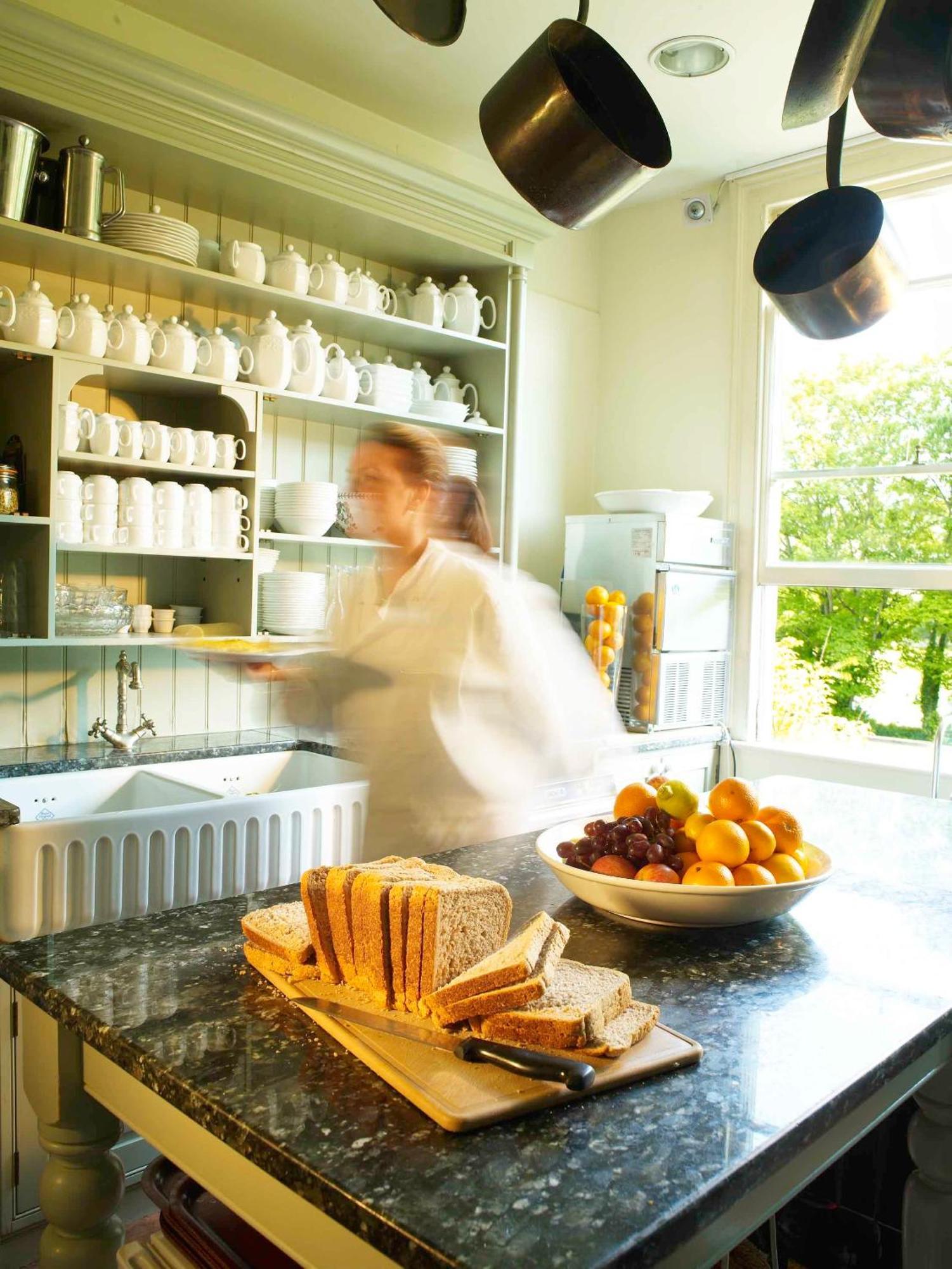 The Windsor Town House Hotel Bath Kültér fotó A kitchen porter clearing a table